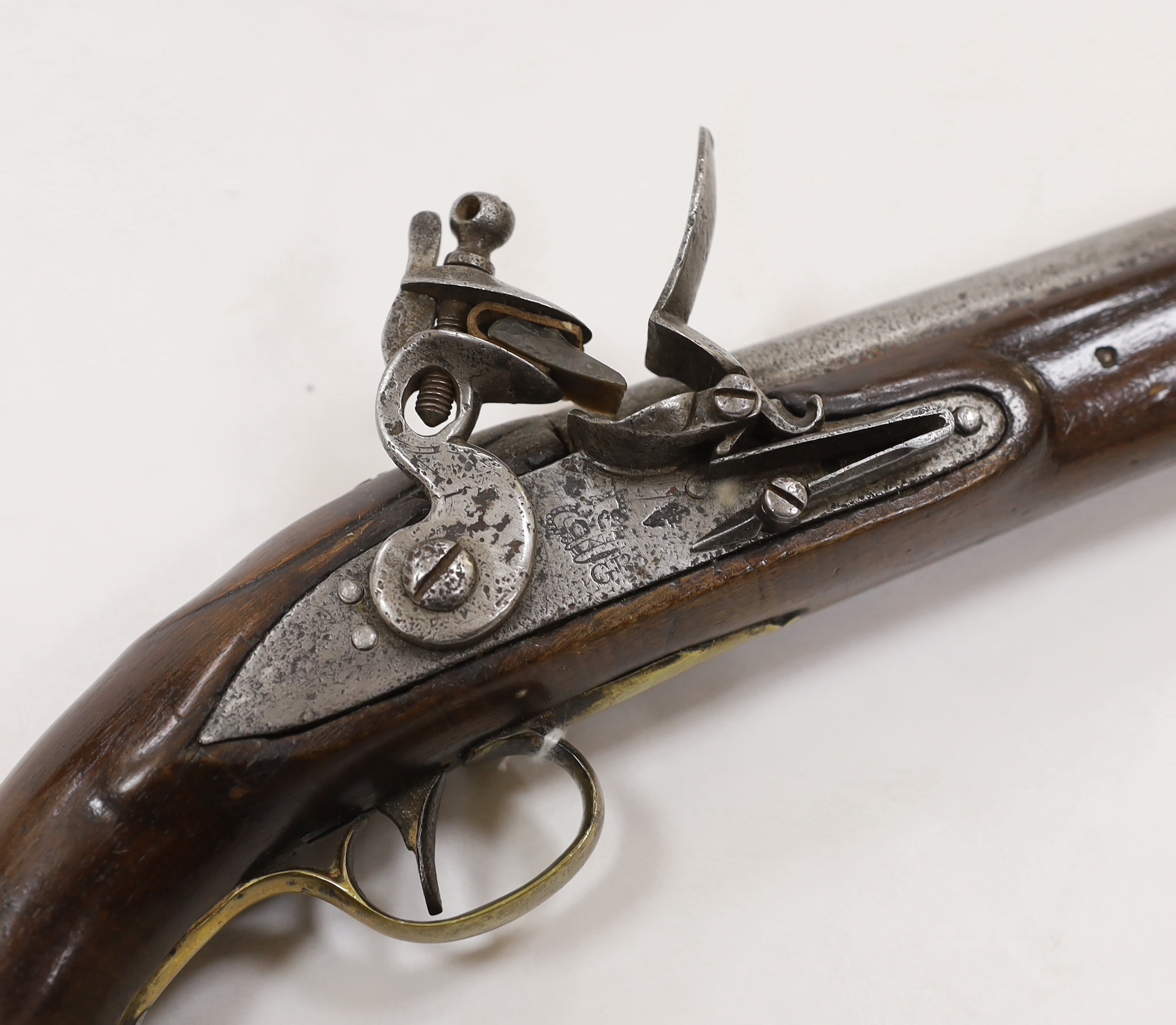 A Regulation type, brass mounted flintlock service pistol, barrel 22.5cm, with associated regulation brass mounts and iron ramrod, lock engraved with crowned GR